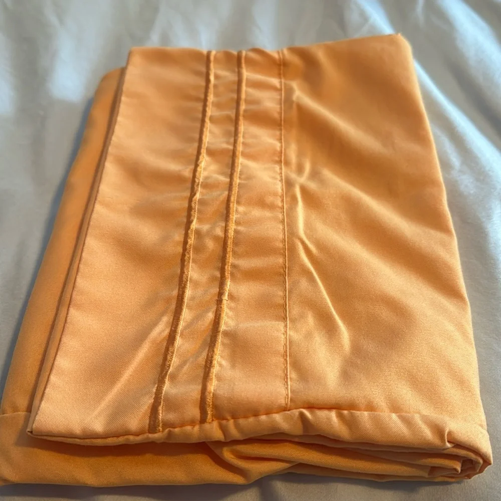 Pair of microfiber pillowcases in tangerine. EUC.